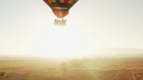 Aerial view of huge balloon in backlit sunrise light Stock Footage 134667765