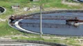 Aerial view of huge circular sedimentation tanks HD Footage