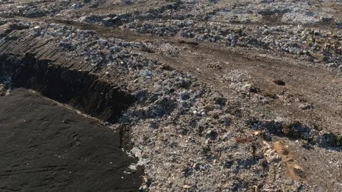 Aerial view of huge city garbage dump at sunset. Wastes of life and production Stock Footage 92865491
