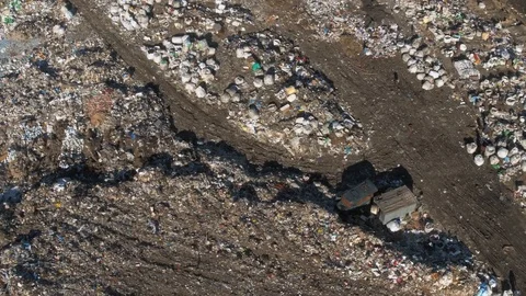 Aerial view of huge city garbage dump at sunset. Wastes of life and production. Stock Footage 92882152