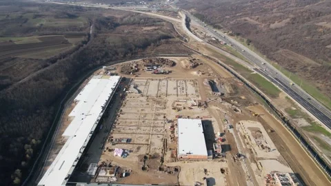 Aerial view on huge construction site with heavy equipment and workers. Stock Footage 295234945