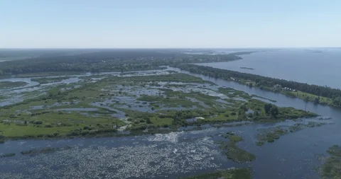 Aerial view. Huge dam. Drone flies over the river, lakes and swamp. 4K Stock Footage 108635516