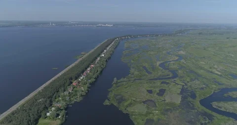 Aerial view. Huge dam. Drone flies over the river, lakes and swamp. 4K Video stock 108635522