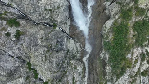 Aerial view of a huge mountain waterfall in the Alps or Caucasus. Stock Footage 274818715