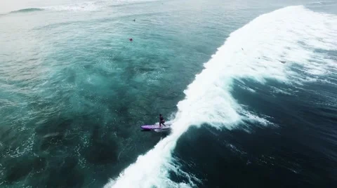 Aerial view of huge ocean waves and surfing in Bali indonesia Stock Footage 63355088
