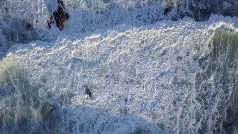 Aerial view on huge waves at sunset. Big ocean waves break with white sea foam Stock Footage 119180133