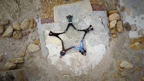 Aerial view of human star formation in Caesarea ruins, Israel. Video stock 95269586