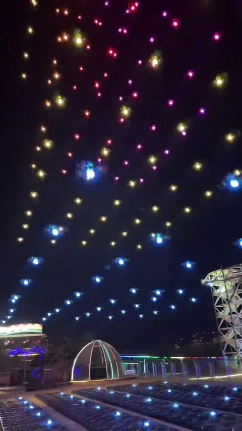 Aerial View of Hundreds of Drones Flying into Night Sky for Light Show Stock Footage 330143932