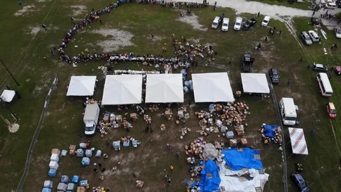 Aerial View of Hurricane Dorian Relief Food Giveaway in Freeport, Bahamas Stock Footage 117913083
