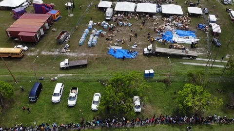 Aerial View of Hurricane Dorian Relief Food Giveaway in Freeport, Bahamas Stock Footage 117915003