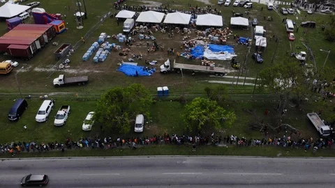 Aerial View of Hurricane Dorian Relief Food Giveaway in Freeport, Bahamas Stock Footage 117915087