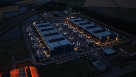 Aerial view of a hyperscale data center at night Stock Footage 340349970