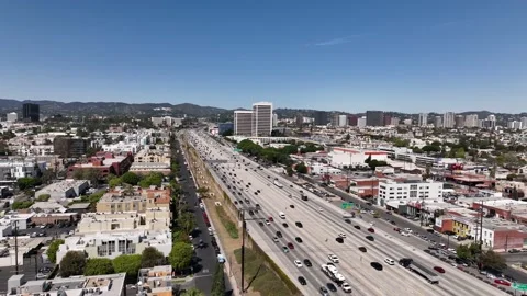 Aerial view of I-405 freeway in Los Angeles California on a sunny day Stock Footage 231808322