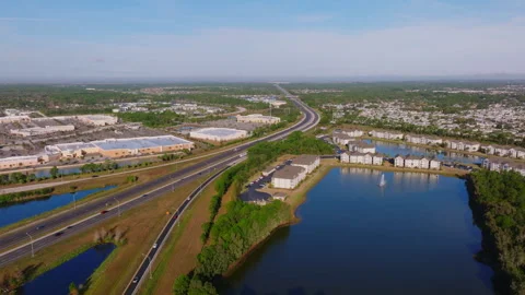 Aerial view I-95 corridor Palm Bay Florida retention pond ProRes 422HQ Stockbeeldmateriaal 335930563