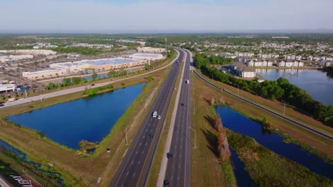 Aerial view I-95 Palm Bay Florida retention ponds winter  ProRes 422HQ 스톡 동영상 335921048