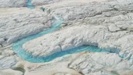 Aerial View Ice Blue Water Cutting Across Frozen Glacier, Usa Stock Footage