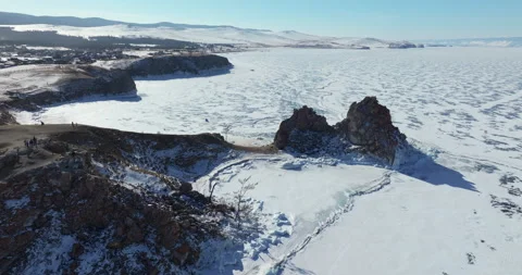 Aerial View of Ice Cracks and Shaman Rock on Lake Baikal Stock-Footage 332389370