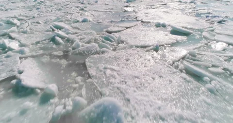 Aerial view of ice on the sea with sunlight. 4 in 1 pack Stock Footage