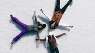 Aerial View Ice Skating People Doing Snow Angel Ice Rink Stock Footage