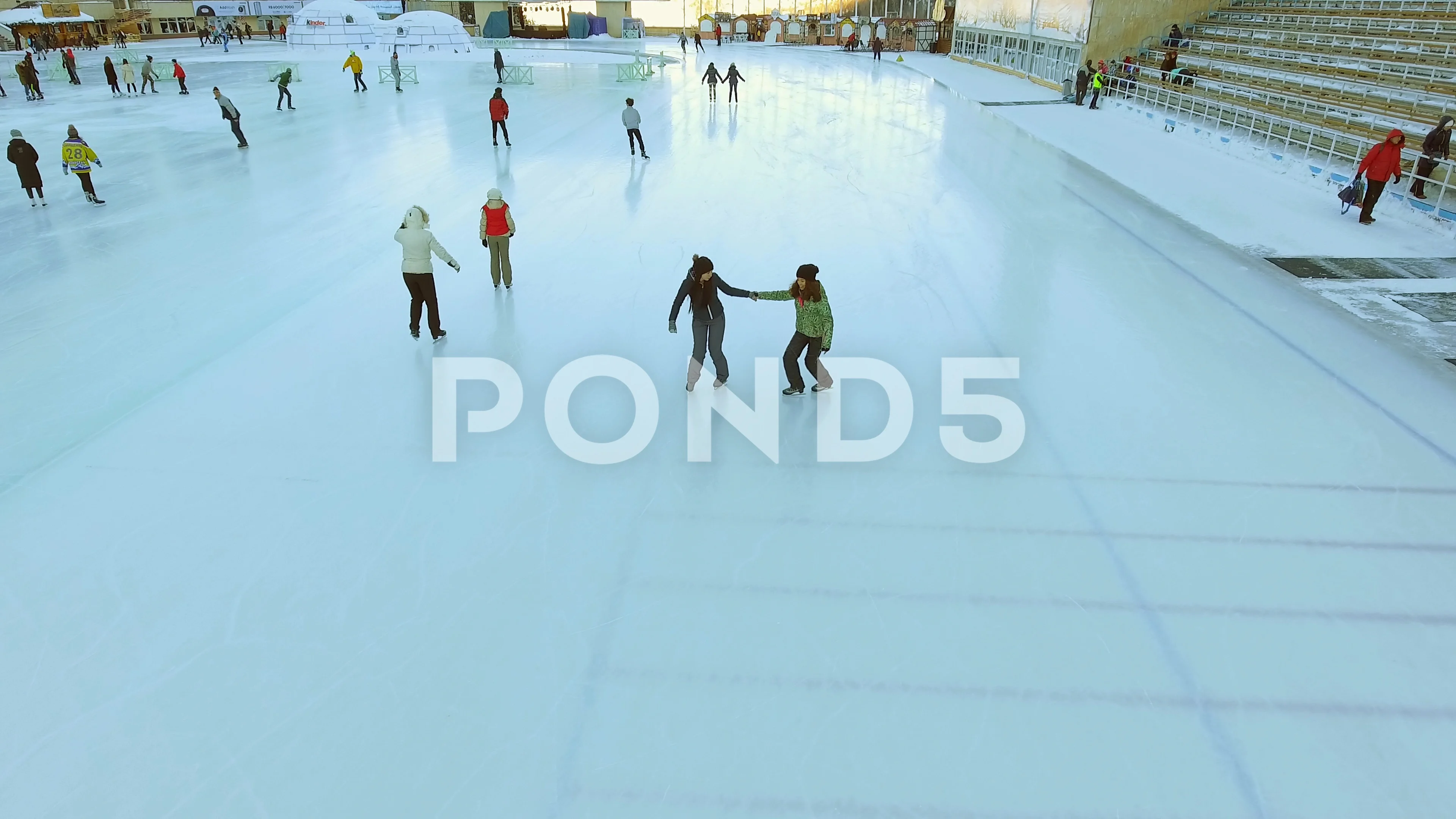 Video Aerial View Of Ice Skating Two Women Friends Outdoor Ice