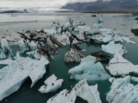 Aerial view of icebergs and formations in Jokulsarlon Glacier Lagoon river Stock-Footage 80621178