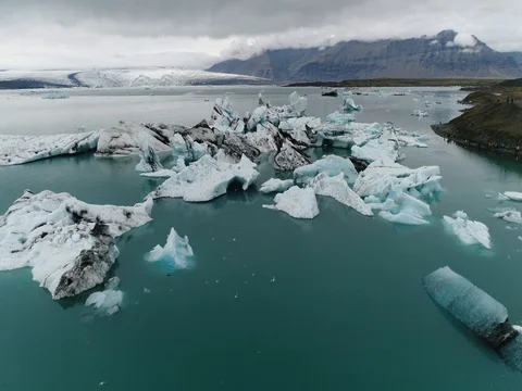 Aerial view of icebergs and formations in Jokulsarlon Glacier Lagoon river Stock-Footage 80621212
