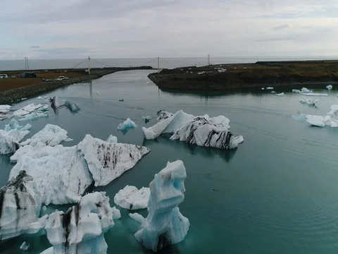 Aerial view of icebergs and formations in Jokulsarlon Glacier Lagoon river Stock Footage