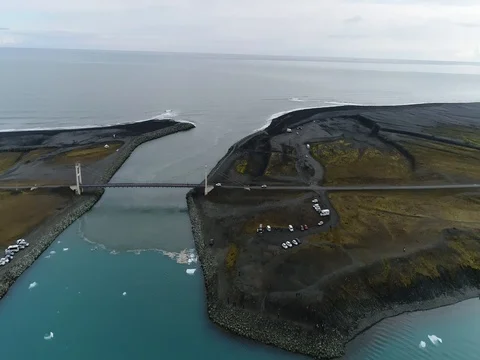 Aerial view of icebergs and formations in Jokulsarlon Glacier Lagoon river Stock Footage