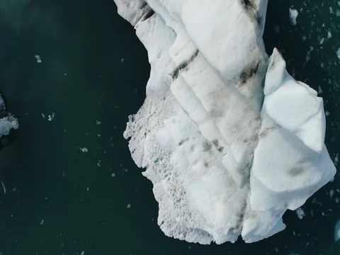 Aerial view of icebergs and formations in Jokulsarlon Glacier Lagoon river Video stock 80621390