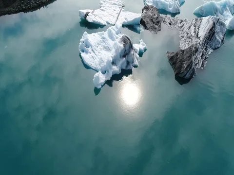 Aerial view of icebergs and formations in Jokulsarlon Glacier Lagoon river Stock Footage