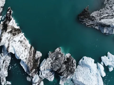 Aerial view of icebergs and formations in Jokulsarlon Glacier Lagoon river Stock Footage