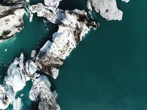 Aerial view of icebergs and formations in Jokulsarlon Glacier Lagoon river Stock Footage