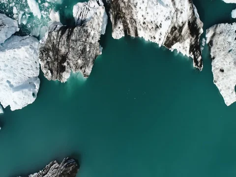 Aerial view of icebergs and formations in Jokulsarlon Glacier Lagoon river Stock Footage 80621543