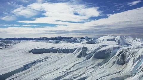 Aerial view. Icebergs float in the blue water of a remote Greenland fjord  Stock Footage 328971090