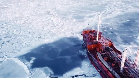 Aerial view of icebreaker ship navigating frozen ocean Stock Footage 334987775