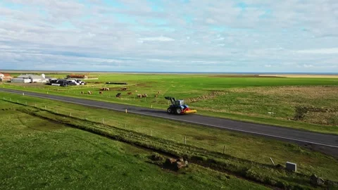 Aerial view of Icelandic highway and green farmland 4K Stock Footage 344128899
