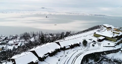 Aerial view of the iconic Dal Lake turned into a frozen mirror in Kashmir. Stock Footage 310656378