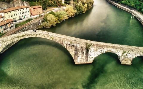 Aerial view of the iconic Devils Bridge in Tuscany, Italy, surrounded by sc.. Stock Photos