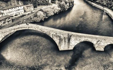 Aerial view of the iconic Devils Bridge in Tuscany, Italy, surrounded by sc.. Stock Photos
