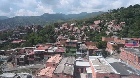 Aerial view from  the iconic Metrocable (cable car) system over Comuna 13 Stock Footage 168253937