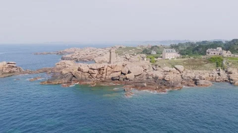 Aerial view of the iconic Phare de Mean Ruz lighthouse on the Pink Granite Coast Stock Footage 346671143