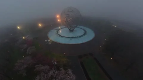 Aerial view of the iconic Unisphere in Flushing Meadows Corona Park on a foggy Stock Footage 333345052