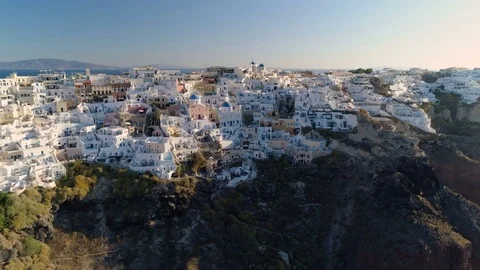Aerial view of iconic white houses and blue dome churches, Santorini, Greece Stock Footage 80458738
