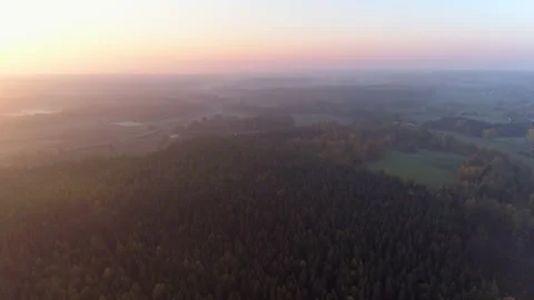 Aerial view of idyllic landscape at dawn in Southern Sweden at foggy sunrise Stock Footage 132805929