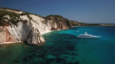 Aerial view of idyllic sandy beach with luxury yacht Stock Footage 92482760