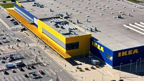 Aerial view of IKEA retail store building and parking lot with moving cars Vídeos de archivo 336697242