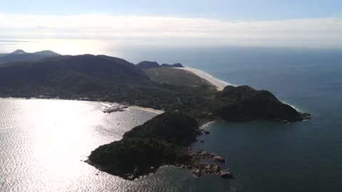 Aerial view of Ilha do Mel, Paraná coast, with beaches, forest, and rocky Video stock 314561527
