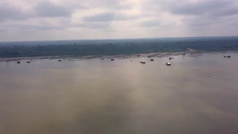 Aerial view of illegal gold mining rafts on the Madeira River, Amazon, Brazil.  Stock Footage 233023122