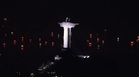 Aerial view of illuminated Christ the Redemeer Statue at Night, Rio de Janeiro Stock Footage