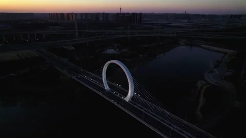 Aerial View of Illuminated Circular Bridge Over River at Night Vídeos de archivo 337417362